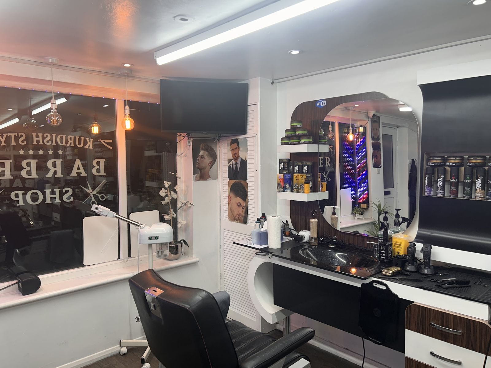 A barber's chair and mirror station inside Kurdish Style Barber
