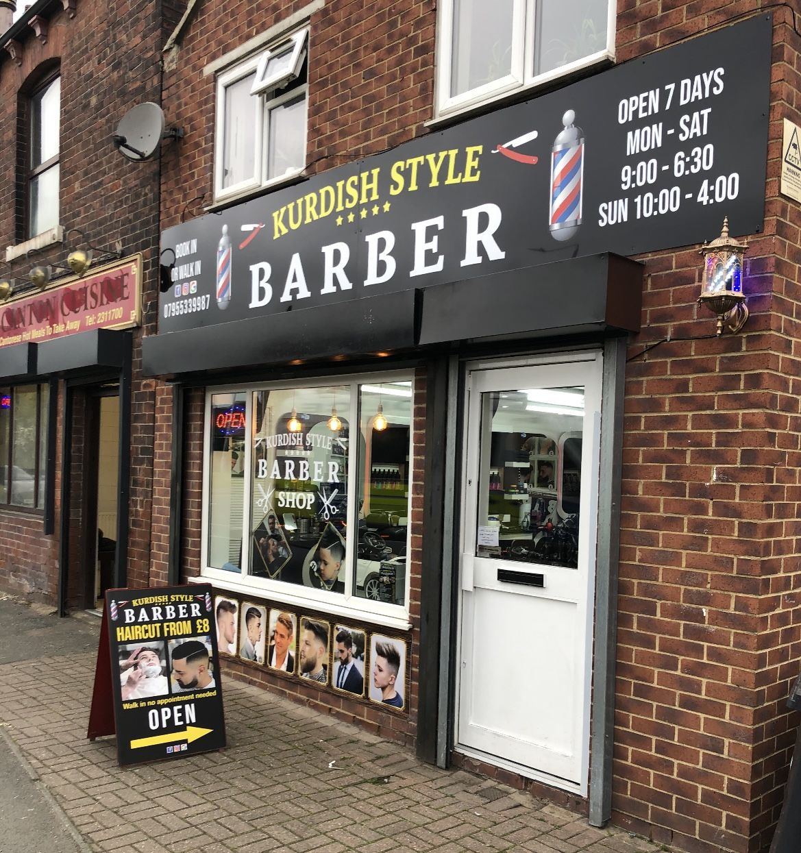 The Kurdish Style Barber shopfront on Tong Road with its black and yellow sign and A-board